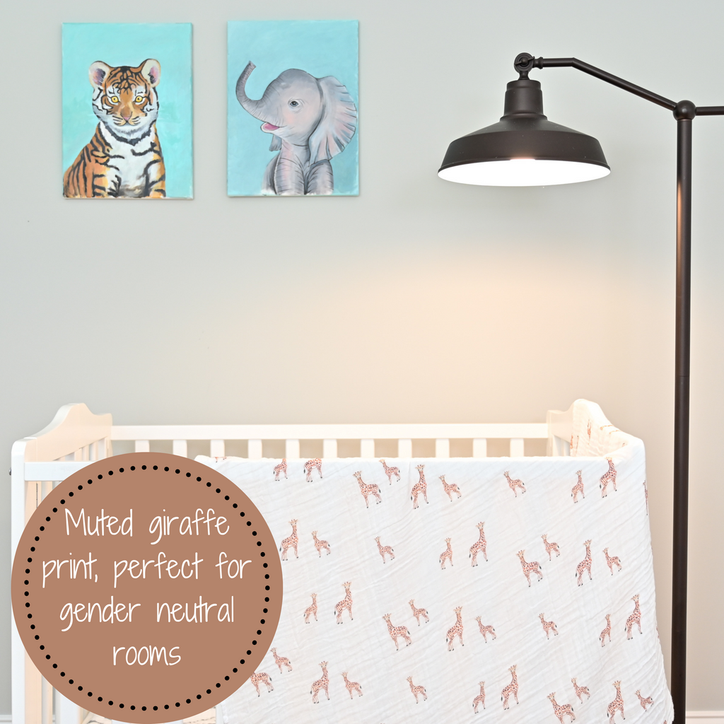 The Giraffe Dreams 100% Muslin Cotton Swaddle Blanket - 47" x 47" gracefully draped on a crib, infusing a sense of playful charm into the nursery.
