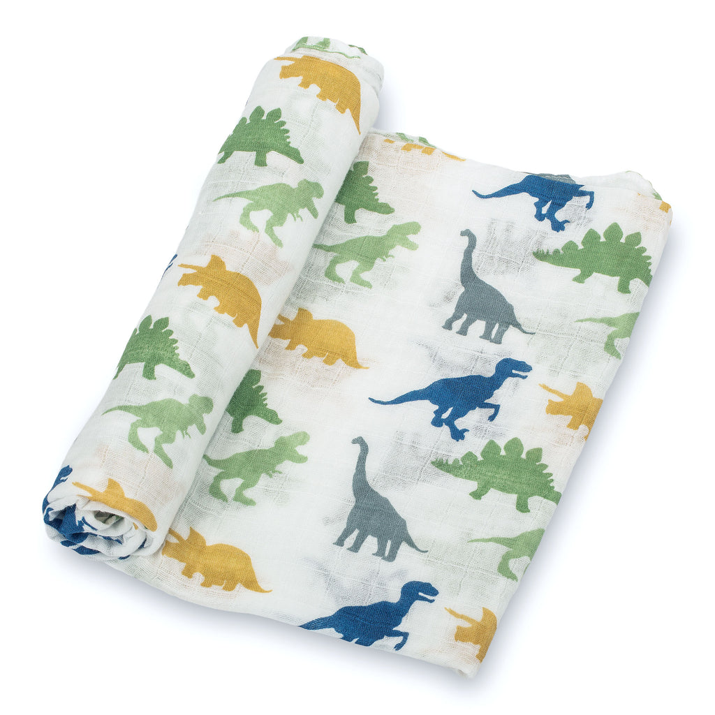 Close-Up View: Vibrant Dinosaur Design on 100% Muslin Cotton Swaddle Blanket - 47" x 47", showcasing the charming prehistoric pattern and the soft fabric texture