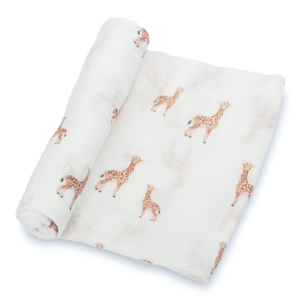 Close-Up View: Adorable Giraffe Design on 100% Muslin Cotton Swaddle Blanket - 47" x 47", showcasing the charming giraffe pattern and the soft fabric texture.