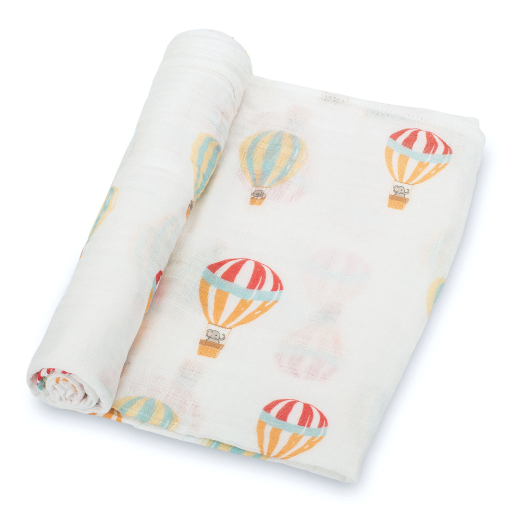 Close-Up View: Charming Hot Air Balloon Design on 100% Muslin Cotton Swaddle Blanket - 47" x 47", showcasing the delightful balloon patterns and the soft fabric texture.