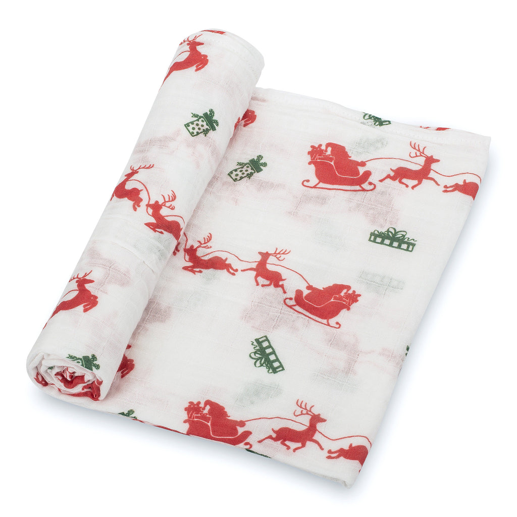 Close-Up View: Detailed Santa and Reindeer Design on 100% Muslin Cotton Swaddle Blanket - 47" x 47", showcasing the charming holiday pattern and soft fabric texture.